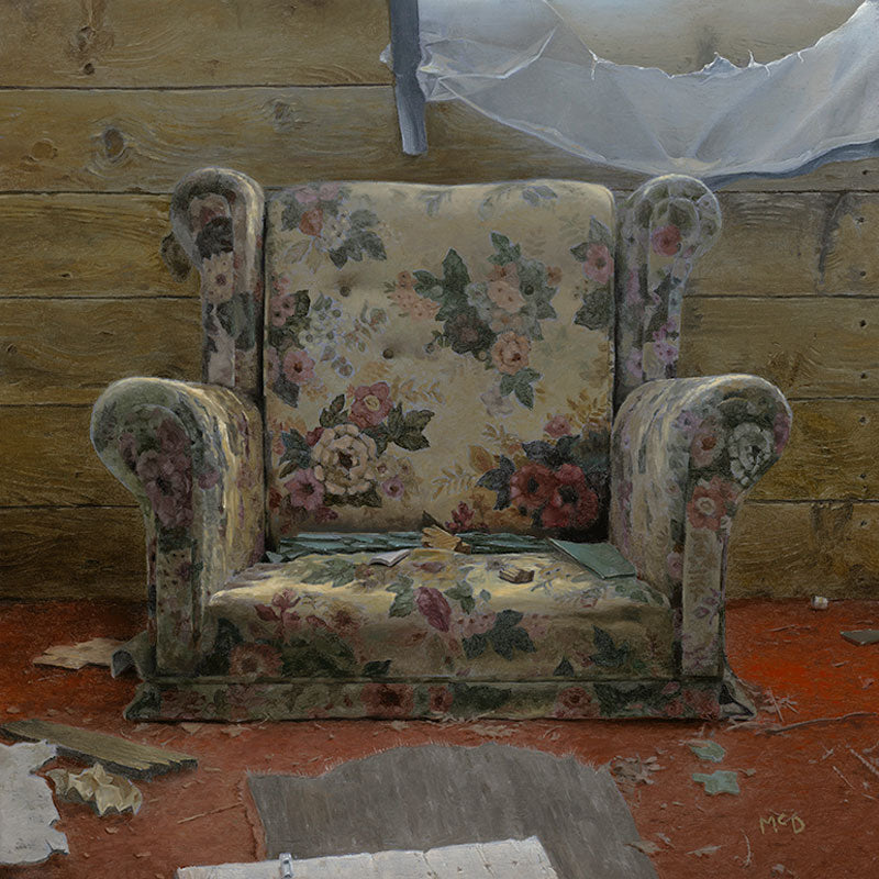 Floral-patterned armchair in a rustic